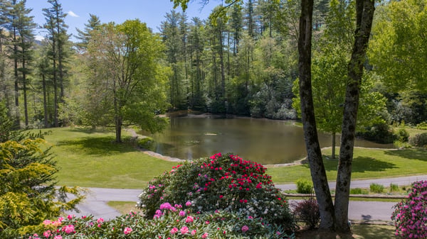 Discover this peaceful property with lush landscaping and a private pond, ideal for outdoor relaxation.