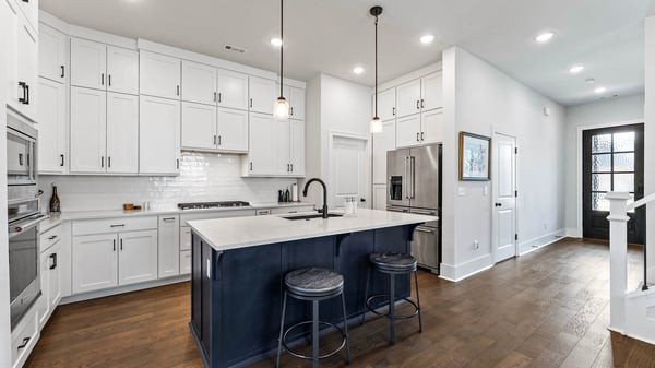 Kitchen with island and cabinets to the ceiling for extra storage