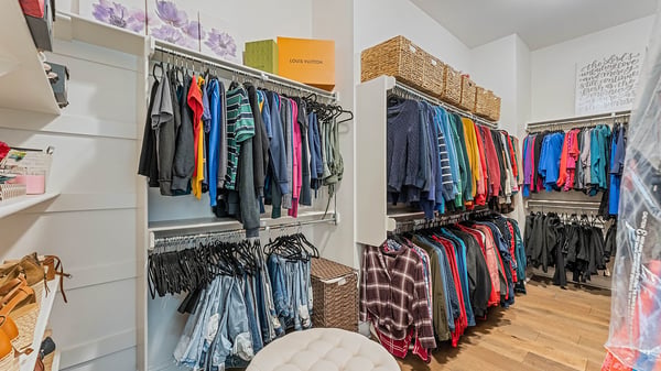 Extra large walk in closet primary bedroom.