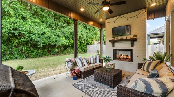 Covered outdoor living space with gas fireplace