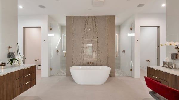 Contemporary Paradise Valley bathroom featuring a freestanding soaking tub, dual vanities, and elegant marble feature wall. Designed for relaxation, this space delivers spa-inspired luxury and modern finishes.