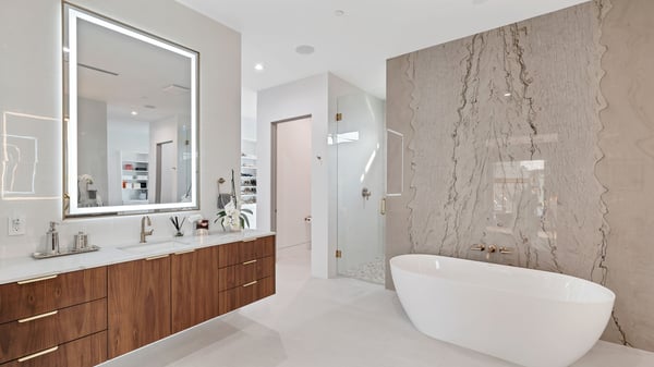 Sleek bathroom with freestanding tub, custom vanity, and glass shower enclosure. This Paradise Valley home showcases luxury upgrades and spa-inspired design elements.