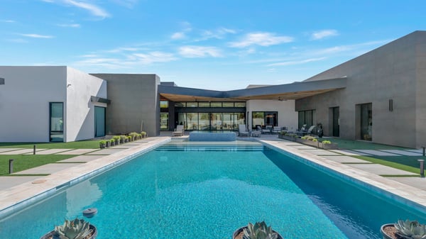 Stunning pool area with modern design, spacious patio, and desert landscaping. This Paradise Valley outdoor space is perfect for relaxing, entertaining, and enjoying resort-style living.