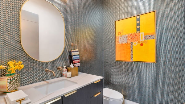 Chic powder room featuring bold textures, contemporary fixtures, and designer finishes. This Paradise Valley home highlights attention to detail and modern luxury.