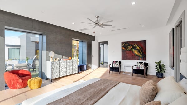 Bright and open primary bedroom with modern finishes and large windows. This Paradise Valley home offers a relaxing retreat with natural light and contemporary design.