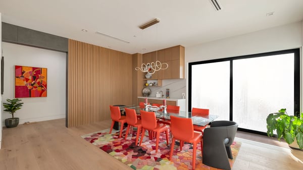 Dining space with bold design elements, modern lighting, and sliding glass doors. This Paradise Valley home creates an inviting area for gatherings and everyday dining.