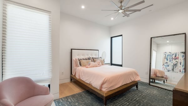 Bright guest bedroom with modern finishes, soft lighting, and comfortable layout. This Paradise Valley home offers welcoming secondary spaces.