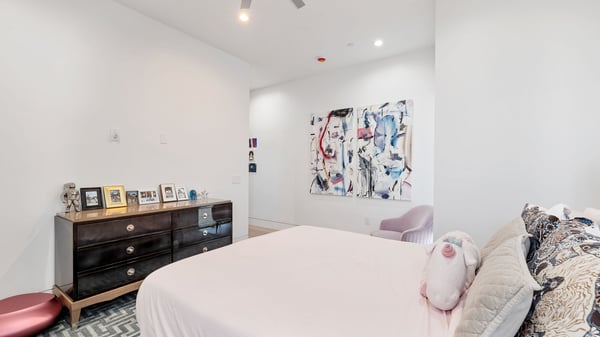 Well-lit bedroom with neutral tones and modern finishes. This Paradise Valley home provides flexible space for guests or family.
