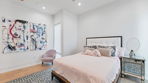 Stylish bedroom featuring clean lines, updated flooring, and contemporary d cor. This Paradise Valley home blends comfort with design.