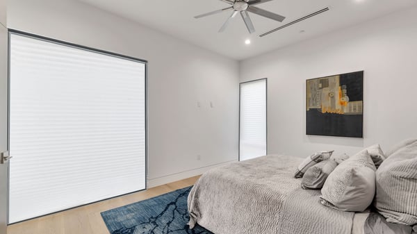 Light-filled bedroom with contemporary finishes and comfortable layout. This Paradise Valley home provides versatile space for guests or family.