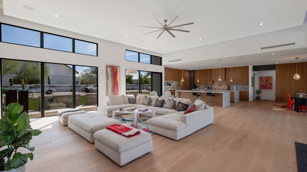 Inviting front living space filled with natural light and open flow to the kitchen. This Paradise Valley home highlights clean lines and contemporary style.