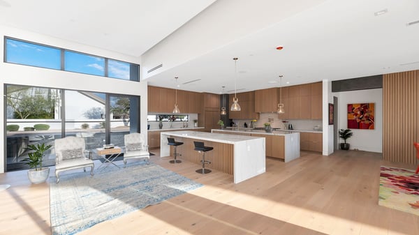 Spacious living room with high ceilings and seamless transition to kitchen and dining spaces. This Paradise Valley home is designed for entertaining and everyday comfort.