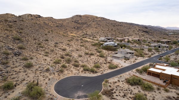 Exceptional hillside lot bordering protected preserve land, offering privacy, scenic desert terrain, and direct access to hiking and biking trails. A rare opportunity to build surrounded by untouched natural beauty.