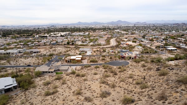 Featured aerial view of this spacious hillside lot showcasing elevated terrain and scenic desert beauty. Perfect for a luxury custom home near South Mountain Preserve and outdoor recreation.