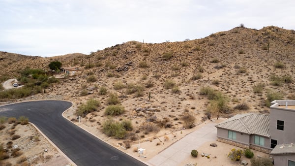 Expansive desert hillside lot offering panoramic mountain scenery and surrounding luxury homes. Located in Phoenix, this elevated property provides the ideal setting for a private custom retreat.