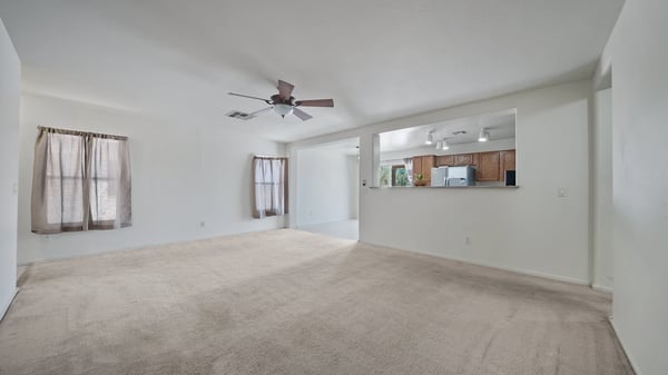 Open-concept living room connects beautifully to the kitchen and dining area, creating an ideal gathering space for family and guests. Bright interiors and neutral colors complement any decorating style.