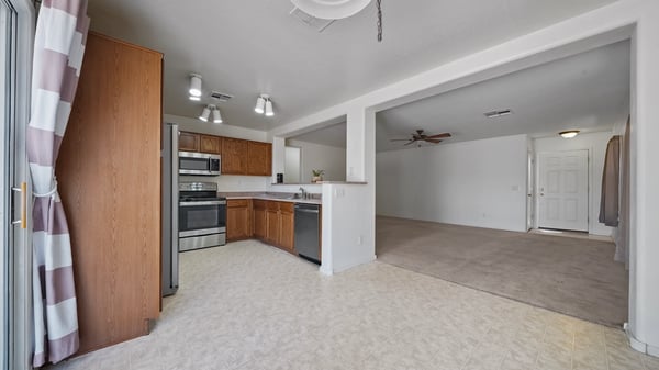 Breakfast nook connects seamlessly with the kitchen and living room, offering an inviting open layout for entertaining and everyday living with convenient backyard access.