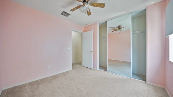 Bright bedroom features a spacious layout, mirrored closet, and neutral finishes, making it easy to adapt as a guest room, office, or hobby space to fit your lifestyle.