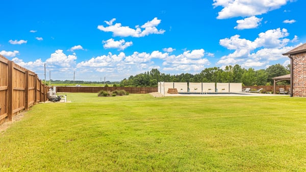 Spacious backyard with ample room for outdoor activities, perfect for creating your ideal retreat.