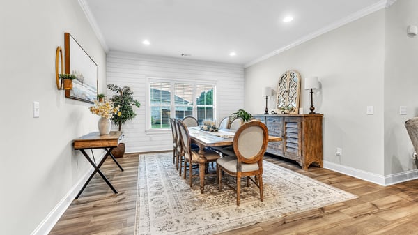 Bright dining area featuring an inviting blend of modern design and cozy warmth, perfect for gatherings.