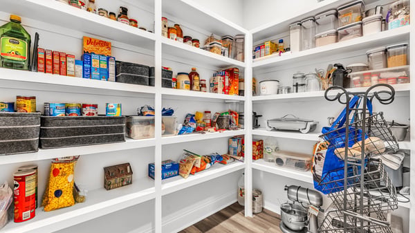 Spacious pantry with organized shelving, perfect for maximizing storage and easily accessing your essentials.