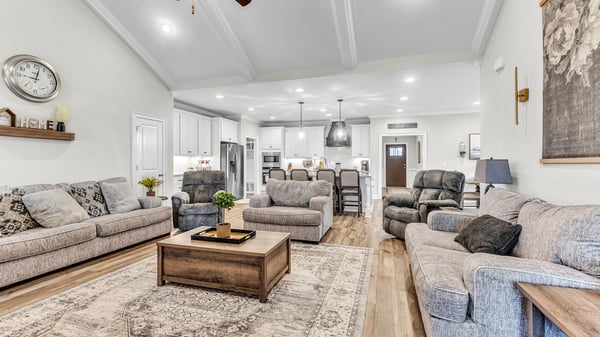 Spacious living area with vaulted ceilings, offering ample room for relaxation and entertaining.