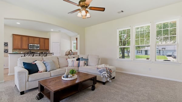 Large windows on both sides of the living room let in tons of natural light.