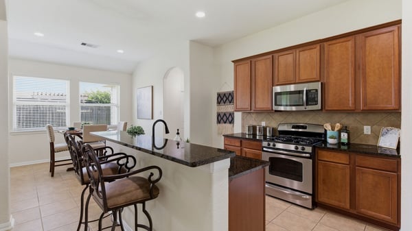 The kitchen provides ample storage and counter space.