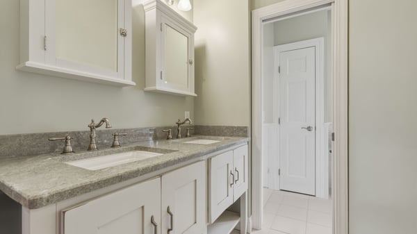 Upstairs full bathroom with double sinks