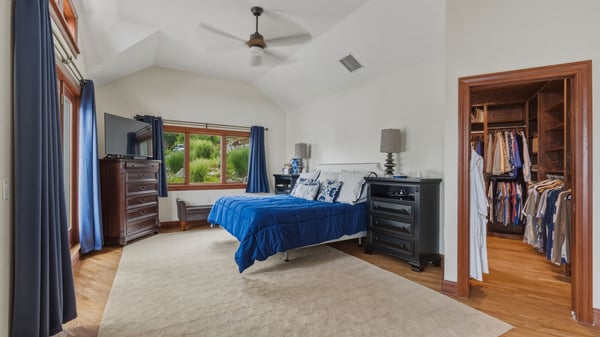 Oversized owner's suite with full bath, walk-in closet, sitting area, and private balcony