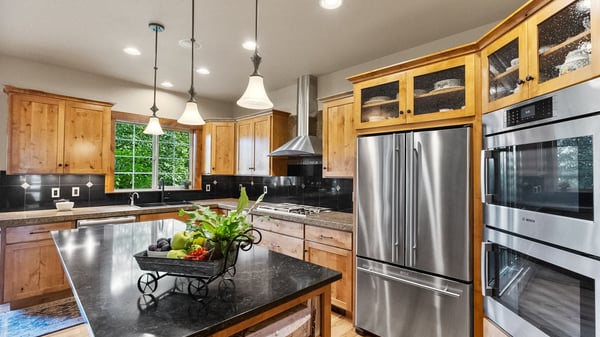 Modern kitchen featuring sleek appliances, ample storage, and a spacious island, perfect for cooking and entertaining.