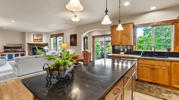 Bright kitchen with ample counter space, seamlessly connecting to the inviting living area and outdoor views.