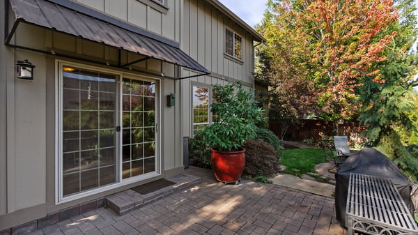 Discover a spacious outdoor patio perfect for relaxation and entertaining in a tranquil garden setting.