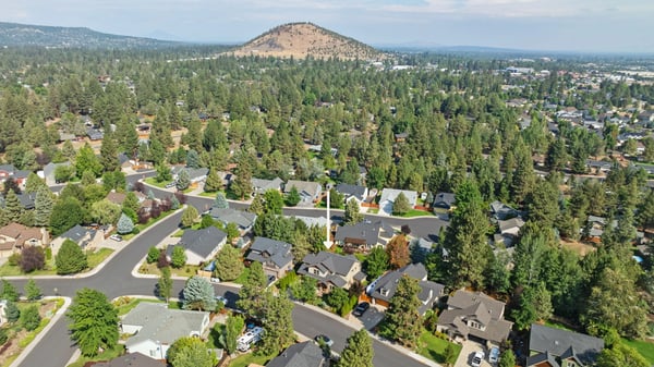 Discover this wooded neighborhood featuring spacious homes, winding streets, and breathtaking mountain views just beyond.
