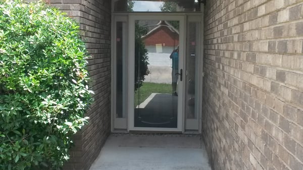 Welcome to a well-maintained entrance that seamlessly connects indoor and outdoor living spaces.