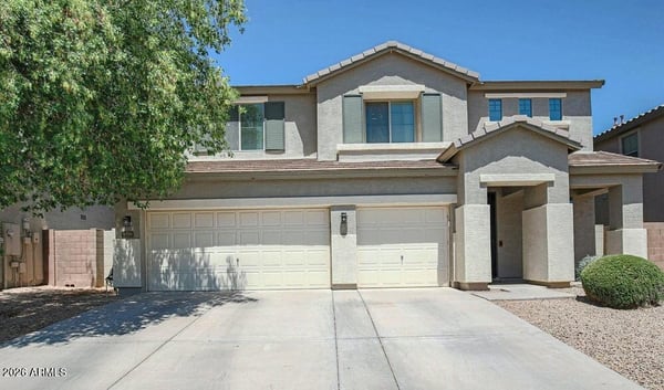 Welcoming front fa ade with desert landscaping, covered entry, and an oversized 3-car garage. This attractive exterior sets the stage for the beautifully renovated interior.