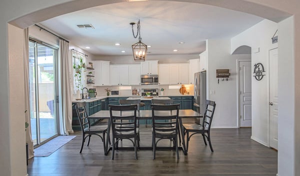 Open dining space that flows effortlessly into the updated kitchen and overlooks the backyard patio. Designed for easy entertaining and comfortable family gatherings.