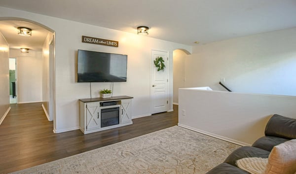 Flexible upstairs loft with updated flooring and generous space for a media room, game room, study area, or additional family room. An excellent bonus space that adapts to your lifestyle.