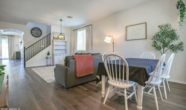 Bright dining area with seamless access to the living room and kitchen, offering an ideal setting for family meals, celebrations, and memorable gatherings in this move-in-ready Waddell home.