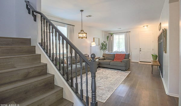 Gorgeous kitchen with quartz countertops, stainless steel appliances, expansive island seating, and an open-concept design perfect for entertaining and everyday family life.