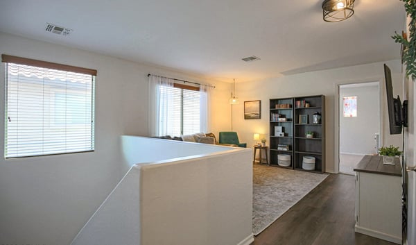 Comfortable loft with updated flooring, entertainment space, and plenty of room for movie nights, gaming, reading, or creating the perfect family retreat.