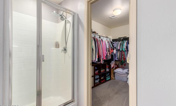 Enjoy a large walk-in closet alongside a separate walk-in shower in the primary suite, offering exceptional storage, convenience, and functionality for everyday living.