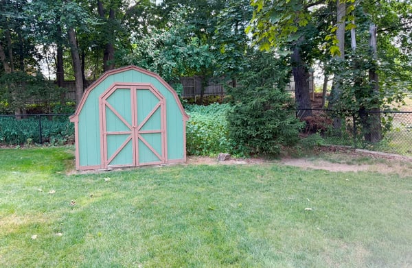 One of 2 Sheds Added by Seller. Seller also installed the fence in 2015: wood privacy fencing along the sides and chain link fencing beyond that with a gate along the back fence line