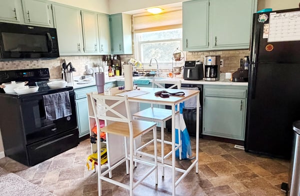 Apartment Kitchen w/ cabinets painted & new counter Oct 2025, cordless shades. Backsplash and lineoleum flooring 2016. Frigidaire refrig 2020, GE DW, Whirlpool electric range & microwave Dec 2025. Island is excluded/belongs to tenants