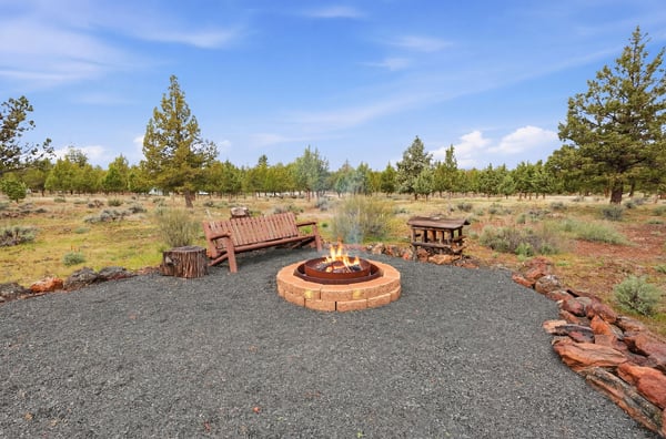 Enjoy evenings around the fire pit in this spacious outdoor retreat, surrounded by natural beauty.