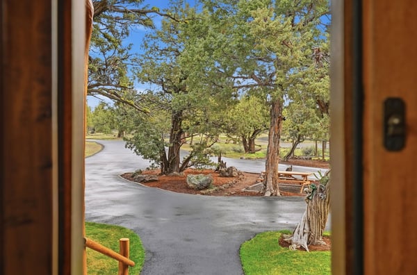 Enjoy expansive views of lush greenery and winding pathways from this inviting entrance.
