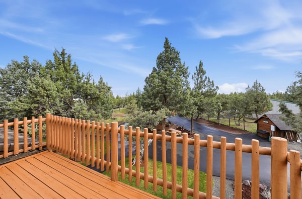 Enjoy breathtaking views from the spacious balcony, overlooking lush greenery and a tranquil outdoor setting.