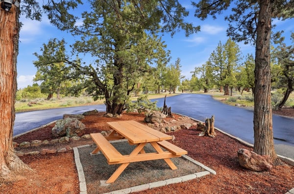 Enjoy outdoor gatherings at this spacious picnic area surrounded by nature, perfect for relaxation and recreation.