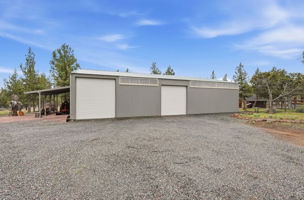 Spacious workshop with ample parking, perfect for hobbyists and those needing extra storage space.
