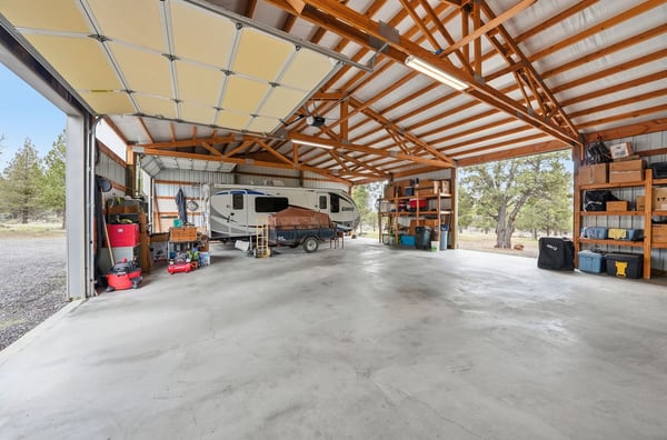 Spacious, versatile garage with ample storage, ideal for vehicles, tools, and outdoor gear. Perfect for hobbies!